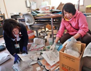 Workers of Japan Agricultural Cooperatives clearing up a mess at a back office of JA farmers' market (in Mashiki-cho, Kumamoto Prefecture)
