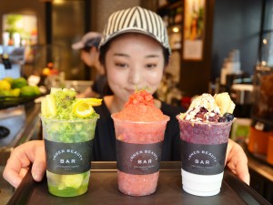 The whole nutrition of a vegetable is taken from shaved ices respectively topped with frozen cucumber (left) and tomato (center). (Shibuya-ku, Tokyo)