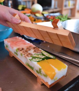 Vegesushi is taken out of a wooden mold in Narashino, Chiba Prefecture.