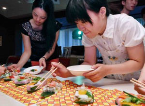 Participants of an event held in Tokyo’s Shinjuku Ward help themselves to vegesushi.