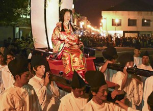 People in old traditional costume paraded through the town to honor Hannya-hime, a legendary daughter of the man who is said to have constructed one of Japan’s national treasures, Usuki stone Buddhas.