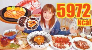 A screen shot of a YouTube video posted by the city of Iki, Nagasaki Prefecture, shows popular big eater YouTuber Yuka Kinoshita promote the city’s local specialties.