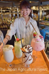 An employee of a beer garden at the top of Matsuya Ginza department store in Tokyo’s Chuo Ward shows a variety of tofu cocktails.