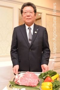 Tomoshige Kanzawa, chairman of the Kobe Beef Marketing and Distribution Promotion Association, shows Kobe beef in the city of Kobe on Feb. 24.
