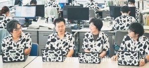 Officials of the Tochigi Prefectural Government’s livestock production promotion division wear Holstein pattern shirts at their office in Utsunomiya, Tochigi Prefecture, every Friday in August.