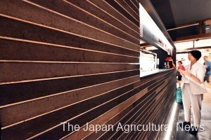  A wall of a store in Tokyo’s Koto Ward is covered with a construction 